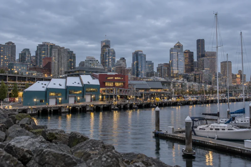 The long Pier 66 cruise terminal on the Seattle waterfront with the downtown towers behind.