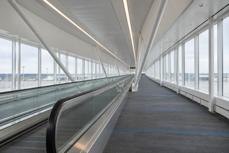 The long glass-sided moving walkway corridor at Seattle-Tacoma airport.