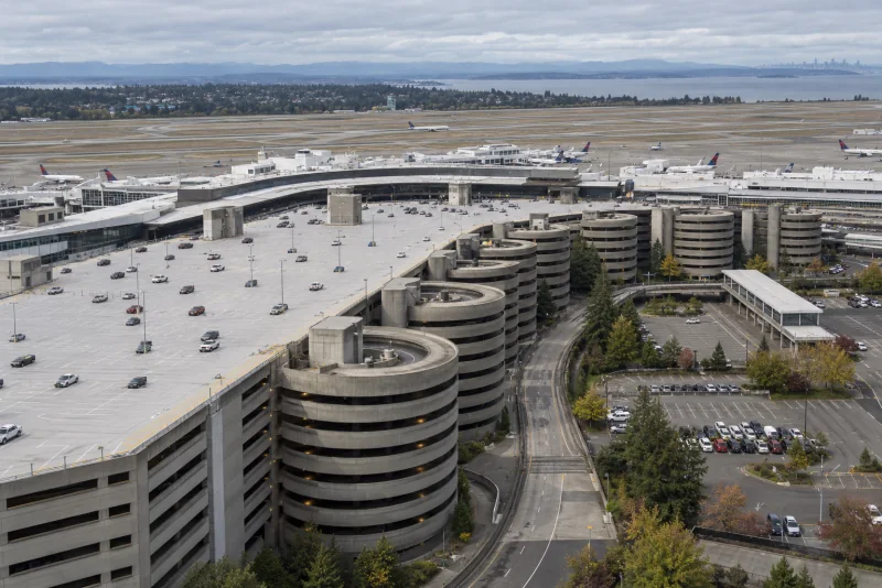 The roof deck and spiral ramp towers of the parking garage seen from above at Seattle-Tacoma airport.
