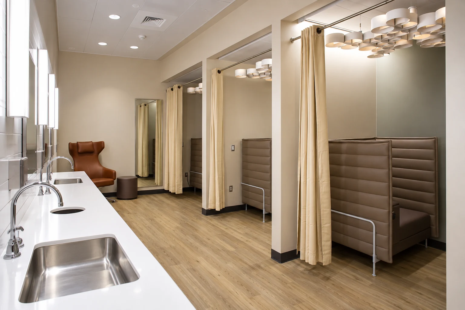 Curtained privacy bays, seating and sinks inside SEA’s N Concourse nursing suite