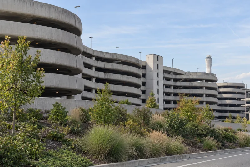 The curved concrete parking garage at Seattle-Tacoma airport seen from outside.