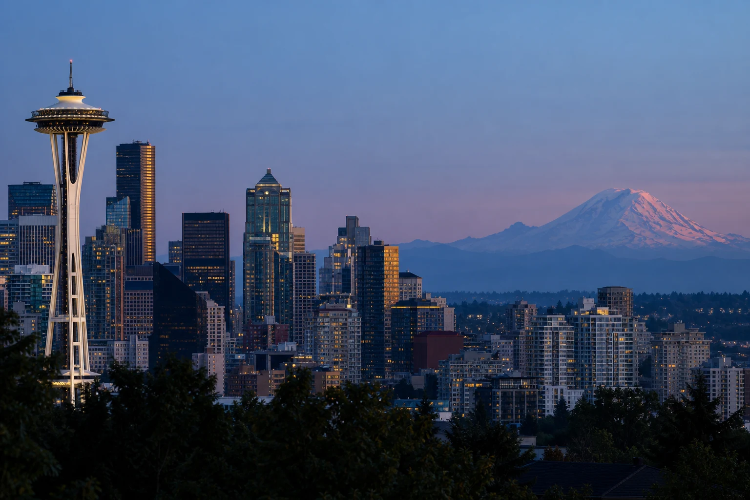 Seattle’s skyline and Mount Rainier seen from Queen Anne at blue hour