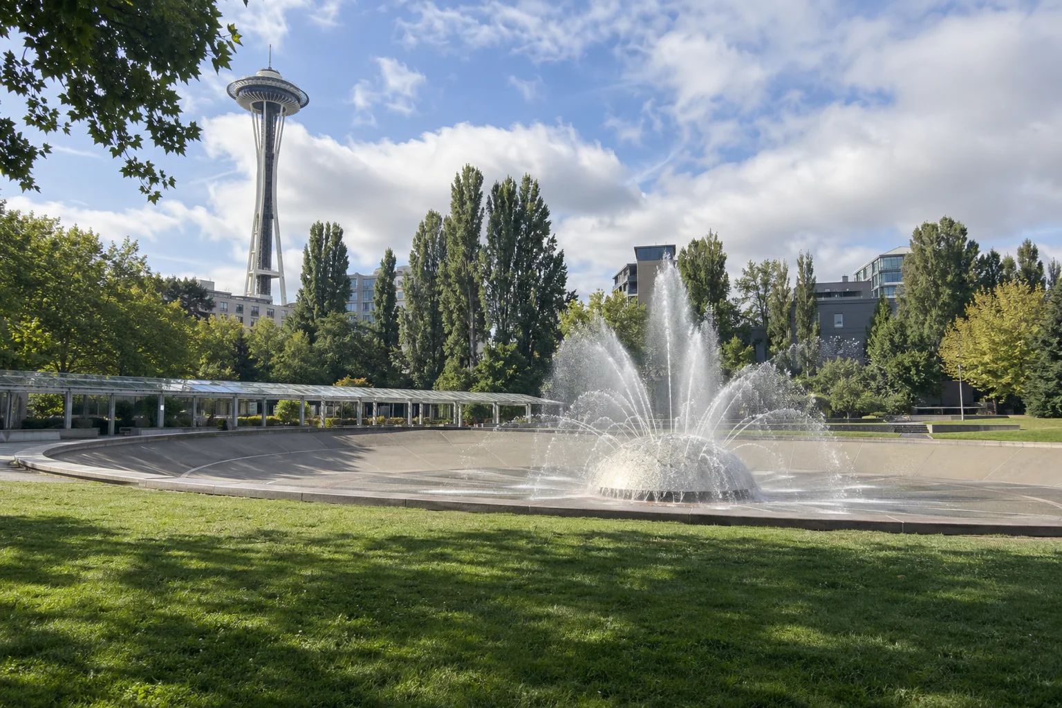 The fountain basin, lawn and Space Needle at Seattle Center in Seattle.